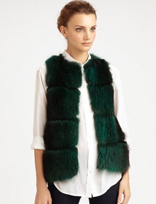 Colorful raccoon fur adds a little edge to a sumptuous vest in a sleeveless, open-front silhouette.Dyed raccoon furCollarlessSleevelessHook-and-eye closureSilk liningSpecialist dry cleanMade in USAFur origin: USA