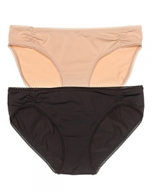 A luxuriously soft bikini with ruching at hips and scalloped edge trim.