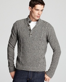 Thick and chunky cable knit detail gives this handsome sweater added personality.