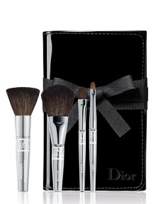 This deluxe travel brush set includes deluxe sizes of Dior's Backstage Powder, Cheek, Eyeshadow and Lip brushes in a foldable patent brush roll. 