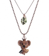 Capture style inspired by the animal kingdom. This cute koala king necklace by Betsey Johnson highlights a chic two-tier design. Crafted in brown mixed metal with crystal accents and a dangling green leaf charm. Approximate length: 16 inches + 3-inch extender. Approximate drop: 1-1/3 inches.