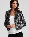 Unabashedly chic with allover sequins for glam appeal, this Karen Kane animal-print jacket is ideal for your next holiday event or dressing up denim.