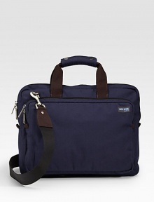 A soft briefcase fit for the streets, office and classroom alike in rugged denier canvas with a convenient laptop compartment and ripstop lining. Zip closure Exterior zip pocket Interior computer sleeve and organizing pockets Top handles, 4 drop Adjustable, detachable shoulder strap, about 44 15½W X 12H X 2D Imported 