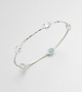 From the Rock Candy® Collection. Five faceted blue topaz stations set on a hammered sterling silver bangle. Blue topazSterling silverDiameter, about 2.5Slip-on styleImported 