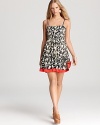 Streaming fireworks amp up this Juicy Couture sundress, while a tiered skirt and poppy-hued hem pile on the playful.