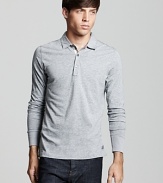 From Burberry, a slim fit longsleeve polo with check accents at the placket lining for a clean, modern look.