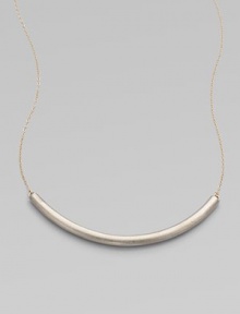 Eye-catching in its elegant simplicity, a gracefully curved, matte-finished silver bar appears to float on a delicate golden chain.SilverplatedGoldtoneLength, about 18Hook claspMade in USA