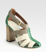 Leather colorblock design with an adjustable ankle strap and a carved wooden heel. Wooden heel, 4 (100mm)Leather upperLeather liningBuffed leather solePadded insoleImportedOUR FIT MODEL RECOMMENDS ordering true size. 