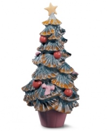 An interesting variation on the classic Christmas tree, Lladro's mini Christmas tree figurine is painted with Lladro's signature palette of soft pastels finished with a high-gloss glaze that catches the eyes. Handcrafted in Spain of pure porcelain.