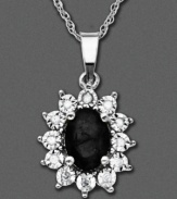 Shining with excellence, this 14k white gold pendant features onyx (5/3 mm) and round-cut diamond accents. Approximate length: 18 inches. Approximate drop: 1 inch.