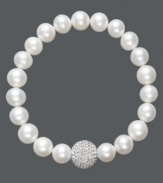 A traditional design receives a sparkling touch. Cultured freshwater pearls (8-9 mm) in shimmery white hues adorn this chic stretch bracelet, while a clear crystal fireball adds extra glamour. Approximate diameter: 3-1/2 inches.