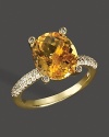 Diamonds accent a checkerboard citrine, set in 14K yellow gold.