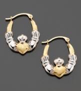 A traditional symbol of love and friendship, these beautiful claddagh hoop earrings are crafted in white & yellow 14k gold. Approximate diameter: 1/2 inch.