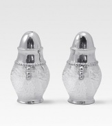 A handmade set of salt and pepper shakers in hammered, sandcast aluminum, buffed by hand for unparalleled shine and elegance. Set of 2 Each, 3½H X 1¾ diam. Sandcast aluminum Hand wash Imported 