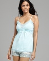 Go for sweet and sexy with a basic camisole accented by intricate lace trim.