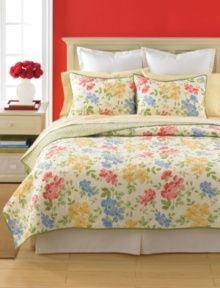 Dream in color. Cheerful watercolor flowers embellish allover quilting for a sensational, seasonless allure. Striped reverse.