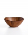 Naturally stunning and totally fresh, this curvy wooden bowl from The Cellar tops the table with easy modern style. Rich acacia wood stands alone or holds candy, popcorn and more.