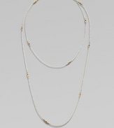 A long-enough-to-double sterling silver chain, delicately spaced with clusters of tiny, faceted 14k gold beads.14k yellow gold and sterling silverLength, about 40Spring ring claspMade in USA