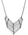 Unique and unexpected. A tapered tube motif lends a chic, contemporary look to BCBGeneration's stylish statement necklace. Crafted in oxidized silver tone mixed metal. Approximate length: 17 inches. Approximate drop: 2-1/4 inches.