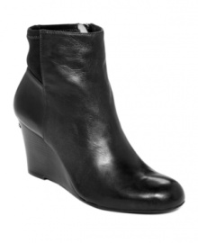 MICHAEL Michael Kors' Bromley wedge booties are perfectly polished with a smooth round toe and a zipper closure on the inner bootie.