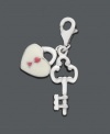 The key to happiness is through the heart. These delicate charms will add the finishing touch to any necklace or bracelet. Crafted in sterling silver with cubic zirconia accents, charm features a key with a pink and white heart-shaped lock. Lobster claw clasp. Approximate drop: 1-1/5 inches.