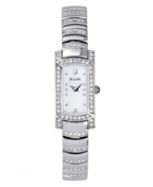 A sparkling take on a glamorous, vintage style. Features mother of pearl dial, curved crystal-accented bracelet and crystal bezel. Water resistant up to 30 meters. Three-year limited warranty.