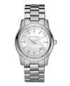 Sophistication fit for everyday, by Michael Kors. Stainless steel bracelet and round case. Silver mother-of-pearl dial features stick indices and crystal accents at markers, logo, silvertone hands and date window. Quartz movement. Water resistant to 100 meters. Two-year limited warranty.