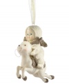 On Dasher! A precious Snowbaby goes for a ride in this ornament from Department 56, crafted of pure porcelain bisque. Fine details of sparkling gold enhance its beauty, sure to bring joy to any tree.