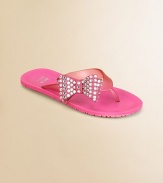 Both elegant and easy, simple jelly flip flops are adorned with rhinestone-studded bows on one side of the strap.Composite rubber upperSide bow with rhinestonesComposite rubber soleImported