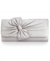 An elegant evening out deserves exquisite accessorizing, like this satin clutch from La Regale. Adorned with a pretty pleated bow and discrete rhinestone accents, it gives your LBD a femme fatale feel.