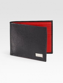 A slim-line design handsomely crafted in Italy from embossed calfskin leather.One bill compartmentSix card slots4¼ x 3½Made in Italy