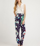 Vibrant florals highlight these sophisticated silk trousers tailored with a high-waist and sleek tapered leg.High waistSelf-beltPleated frontSlash pocketsBack darts below waistRise, about 15½Inseam, about 3495% silk/5% LycraDry clean ImportedModel shown is 5'10 (177cm) wearing US size 4.OUR FIT MODEL RECOMMENDS ordering true size. 