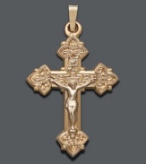 Cherish your beliefs by wearing them proudly. Intricate cross pendant features a scrolling design crafted in 14k gold. Approximate drop width: 3/4 inch. Approximate drop length: 1-1/4 inches.