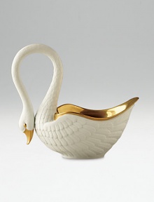 This graceful swan in white porcelain and 14kt gold accents is perfect for serving or decoration. Hand-gilded 7 edition: 3W X 7H X 6½D 13 edition: 6W X 13H X 13D Made in Portugal