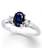 A subtle touch of blue. This vibrant 14k white gold ring features an oval-cut sapphire (1-1/8 ct. t.w.) and round-cut diamond side stones (1/5 ct. t.w.).