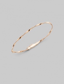 Simply stunning, this 18k rose gold bangle with delicate ridges and twists is great on its own, even better when stacked in multiples. 18k rose goldDiameter, about 2½Tongue-and-groove claspImported