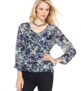 This Calvin Klein Jeans top features a chic layered look. The semi-sheer blouse is perfect with a detachable knit tank top - complete the look with skinny black pants!