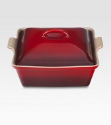 Crafted from heavy stoneware, Le Creuset cookware is the ultimate ingredient for chefs and home cooks worldwide. With its secure lid, this covered casserole is a convenient choice for transporting dishes to parties and picnics. Not only does the lid provide an effective moisture and heat lock for the dish, but it prevents spills and protects its contents.