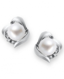 A simple, sophisticated touch. These petite knot-shaped stud earrings feature a cultured freshwater pearl (7 mm) and sparkling diamond accents at the sides. Set in sterling silver. Approximate diameter: 3/8 inch.