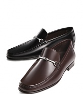 Handsome slip-on dress mocassins with tapered toe. Smooth, polished leather with leather lining and insole. Ornamental metal bit across foot.