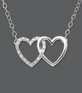 Tell her how she's captured your heart. This heart necklace features two interlocking hearts set in 14k white gold. One heart has been dusted in round-cut diamond accents. Approximate length: 16 inches. Approximate drop: 3/8 inch.