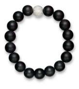 Embolden your look. Matte black agate beads (62-1/2 ct. t.w.) and a textured sterling silver bead make any look pop on this dramatic stretch bracelet. Beads strung on a nylon cord. Approximate length: 8 inches.