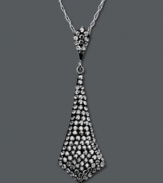 It's a black tie affair. Glam it up in Kaleidoscope's tie-shaped smokey crystal pendant. Crafted in sterling silver with Swarovski elements. Approximate length: 18 inches. Approximate drop: 1-5/8 inches.