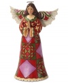 A celebration of fanciful colors and eye-catching shapes, this praying angel adds a charming touch and a folk-inspired accent to your space.