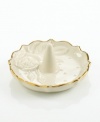 A single rose blossom and delicate dots carved in ivory porcelain make this classic ring holder a fine storage space for special jewelry. With a scalloped, gold-tipped rim. Qualifies for Rebate