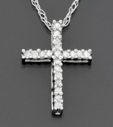 Across her heart… a special cross pendant sparkling bright with round-cut diamonds ( 1/10 ct. t.w.) set in 14k white gold. Diamond necklace chain measures 18 inches; pendant measures 3/4 inches.