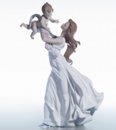 A beautifully detailed evocation of a connection that goes beyond words. This figurine is crafted of fine porcelain, delicate painted hues, and a high gloss finish, so exquisite you can just about feel the cool breeze against your skin. Measures 18.5 x 11.5.