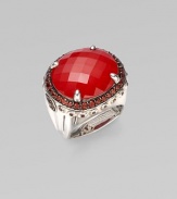 From the Batu Bamboo Collection. A substantial faceted oval of rich red coral sits in a bold bamboo-detailed sterling silver ring, edged by deeply colored pavé garnets. Red coral and garnet Sterling silver Width, about 1 Made in Bali