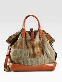 Evoking the aesthetic of vintage fishing bags, a timeless silhouette receives modern polish from a patchwork tweed construction with leather accents.Roller-buckle closureDouble top handlesAdjustable shoulder strapInterior zip pocketAntiqued brass grommet detailingReinforced leather bottomCotton twill liningTweed17W x 16H x 6DImported