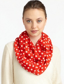 Lightweight wool is adorned with a 60's-inspired polka dot print for mod style.WoolAbout 17 X 77Dry cleanImported